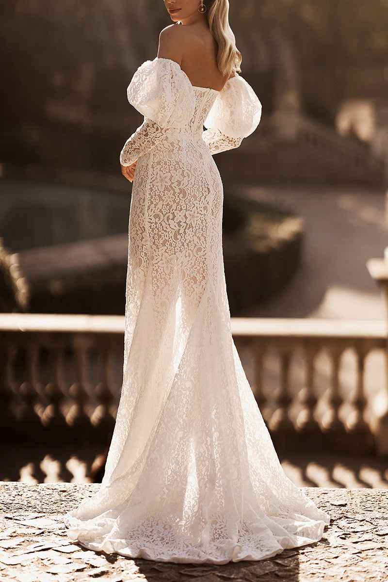 Full length view of an elegant long sleeve bridal gown.