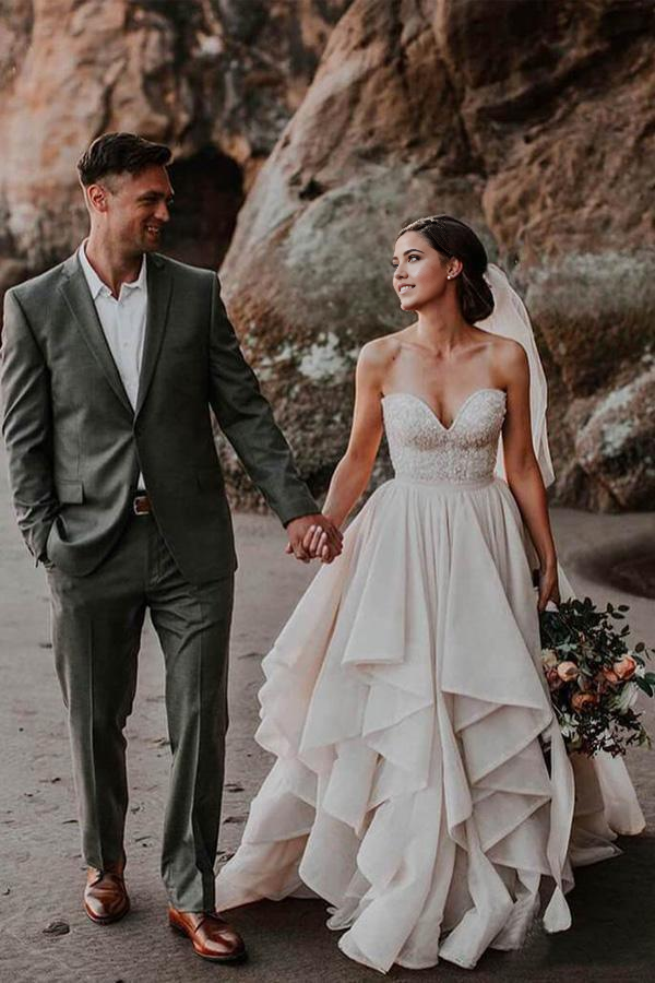 Front view of an elegant A-line sweetheart neck wedding dress with a beaded bodice.