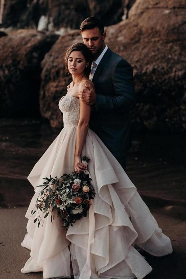 Back view of a floor-length A-line wedding dress with a sweetheart neckline and beaded details.