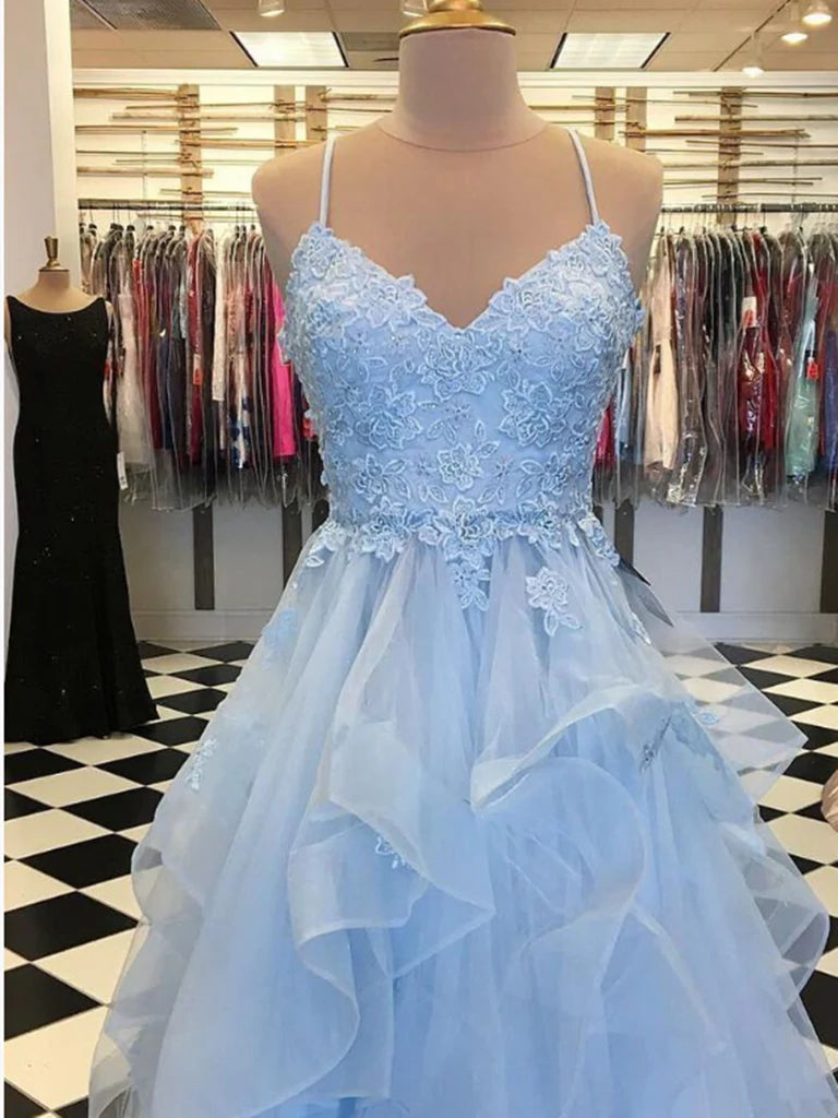 Long evening gown featuring A-line silhouette and delicate lace embellishments.