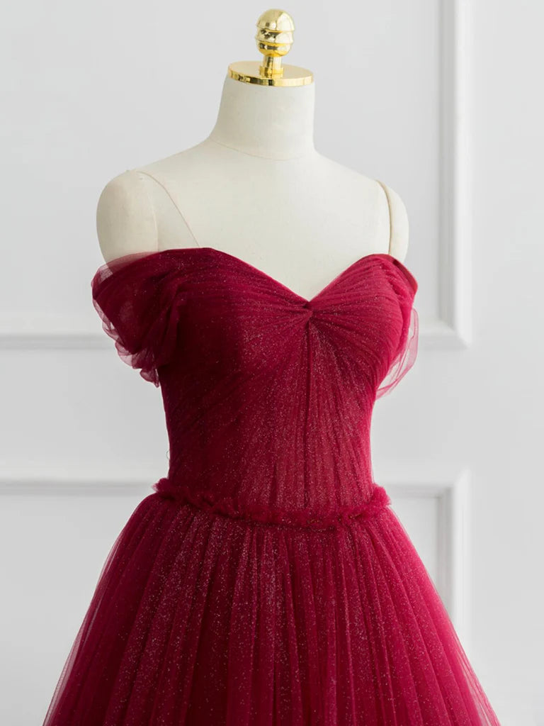 Side view of the flowing tulle A-line prom dress.