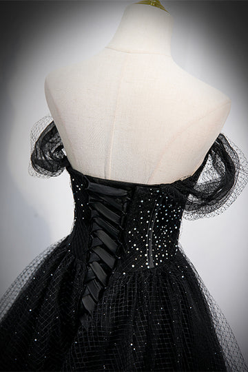 Full length view of the A-line off-the-shoulder beaded prom dress from a different angle.
