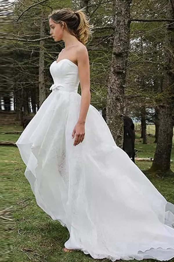 Back view of A-line wedding dress featuring organza applique details.
