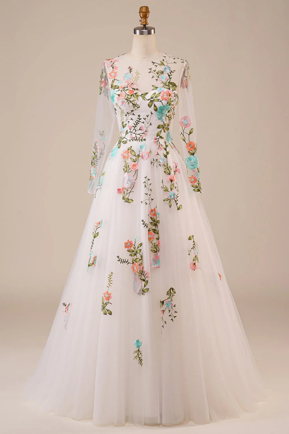 Elegant ivory A-line wedding dress with embroidered tulle and sweetheart neckline.