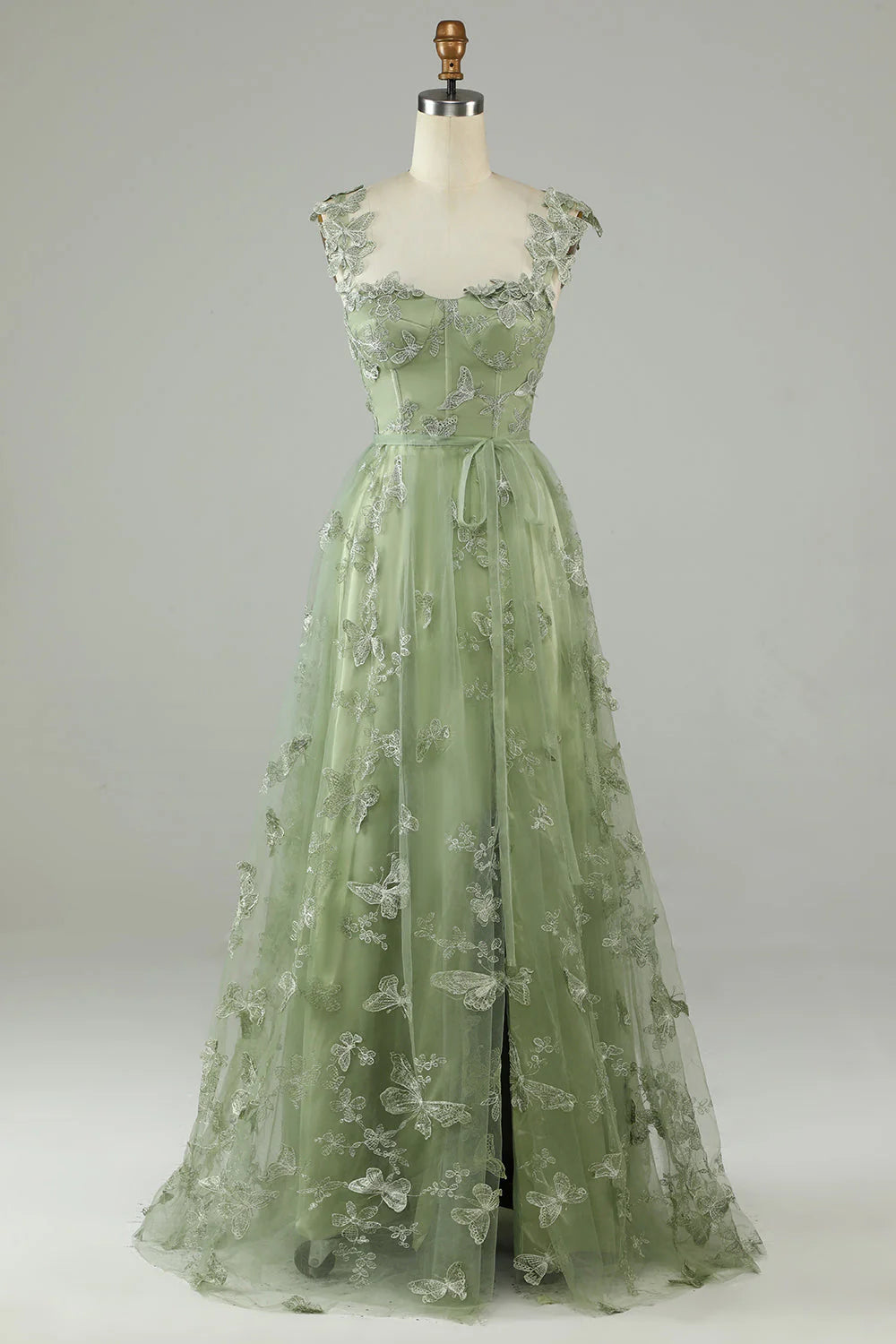 Elegant green tulle prom dress with 3D butterflies, front view.