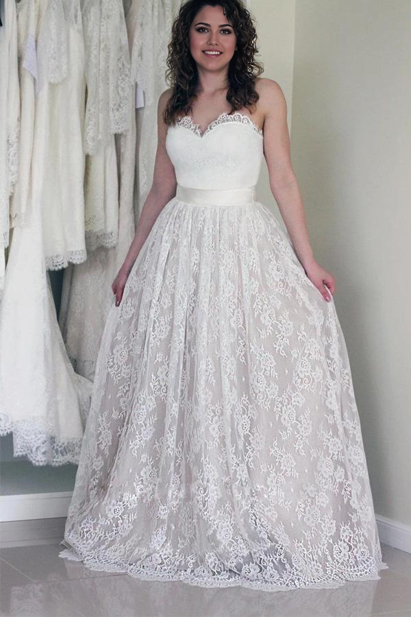 Back view of the A-line sweetheart sleeveless white lace wedding dress.