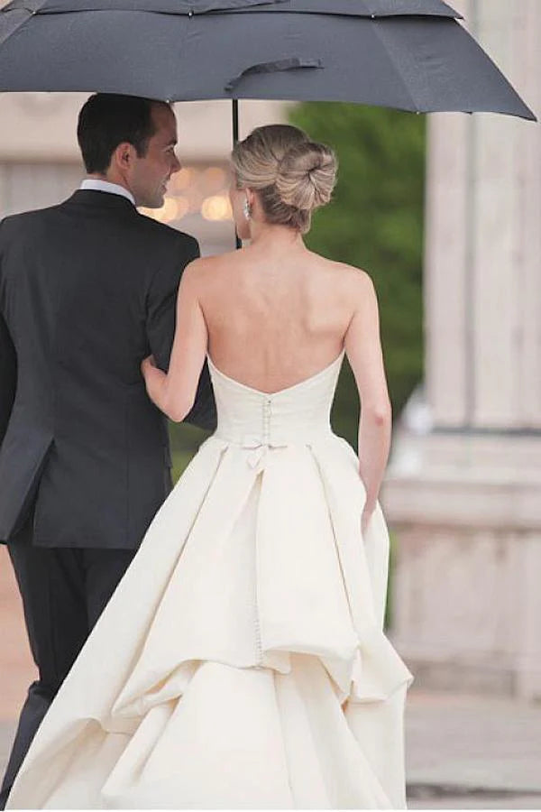 Back view of ivory satin wedding dress showing elegant court train.