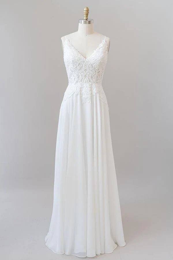 Elegant A-line sweetheart wedding dress with spaghetti straps and appliques.