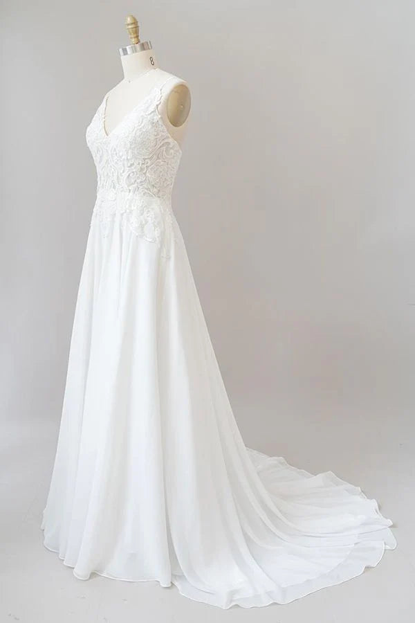 Full length view of elegant A-line wedding gown.