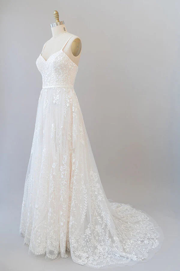 Close-up of appliques on the bodice of a sweetheart wedding gown.
