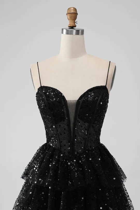 Close-up of the sweetheart neckline and spaghetti straps on a tulle dress.