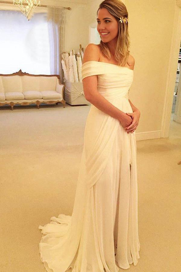 Bride in elegant A-line sweetheart strapless wedding dress.