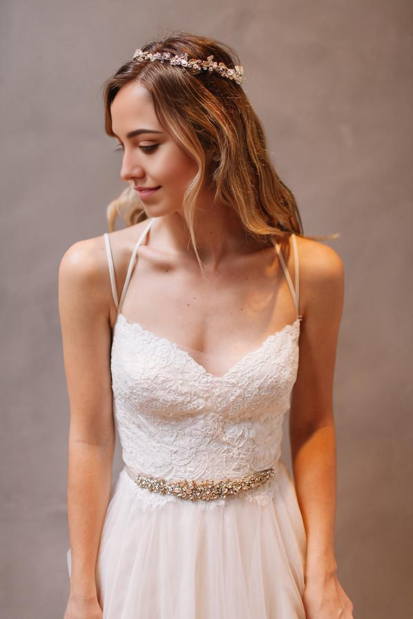 White A-line wedding dress with sweetheart neckline and delicate straps.