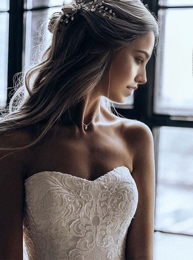 Close-up of the delicate appliques on the sweetheart A-line wedding dress.
