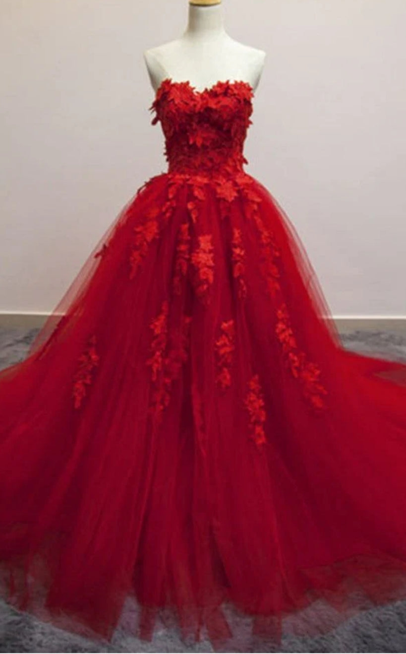Elegant A-line sweetheart tulle ball gown with applique details.