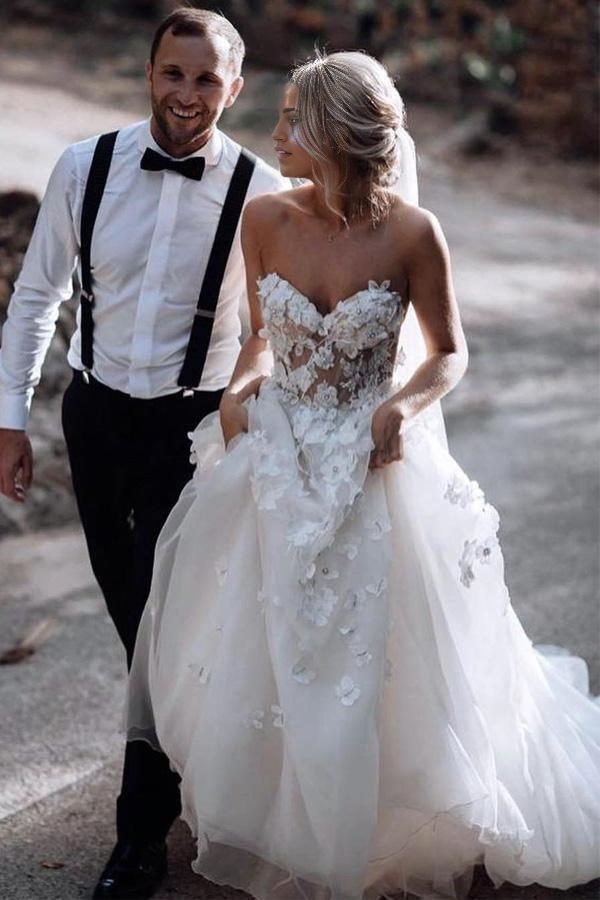 Back view of the A-line tulle wedding gown, showcasing the train and appliques.