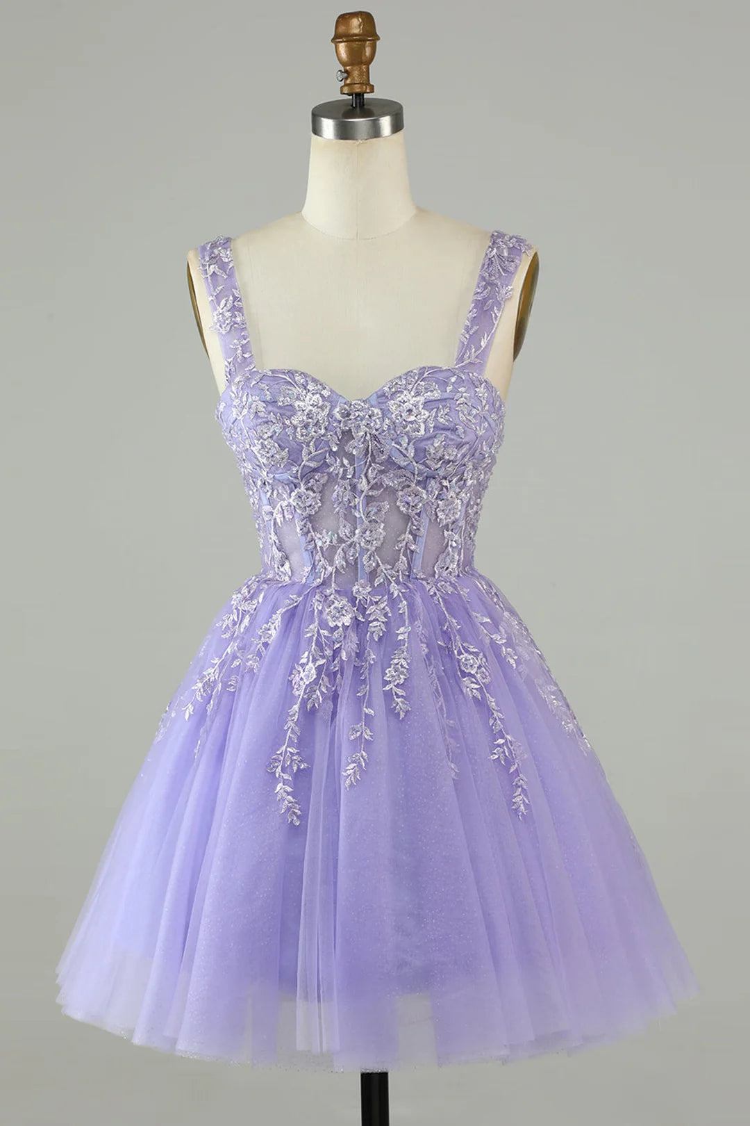 Model wearing an A-line sweetheart tulle appliques homecoming dress.