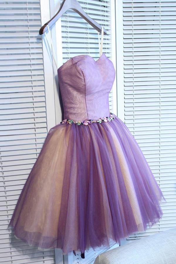 Model wearing an elegant A-line sweetheart tulle mini homecoming dress.