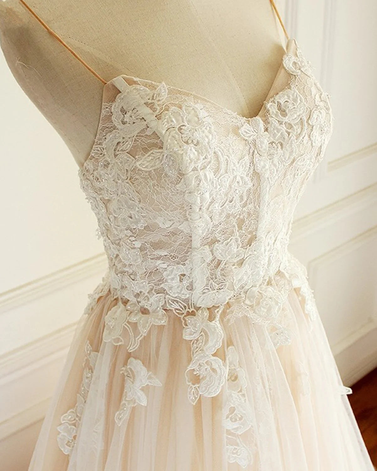 Side view of a bride wearing a long A-line wedding dress.