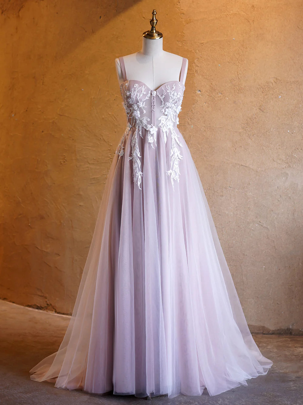 Full view of an elegant light blue A-line prom dress with a sweetheart neckline and sweep train.