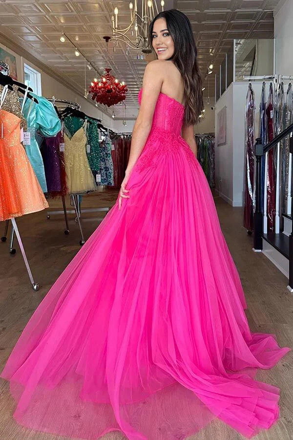 Back view of a long A-line tiered tulle prom dress.