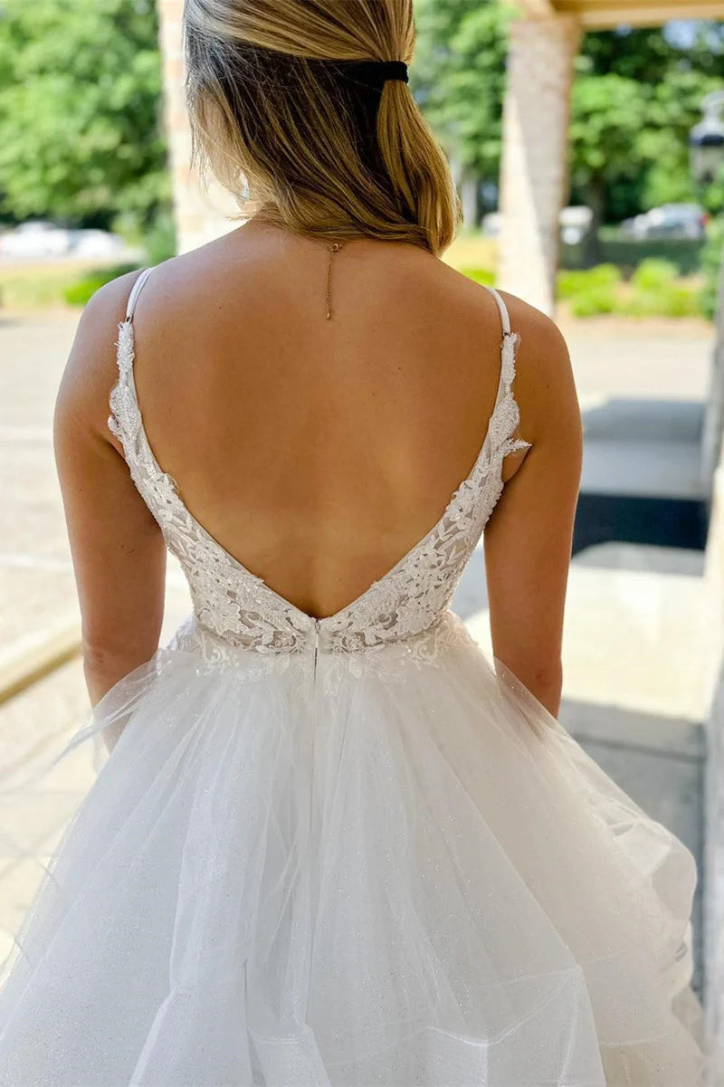Back view of the A-line wedding dress featuring a stunning backless design.