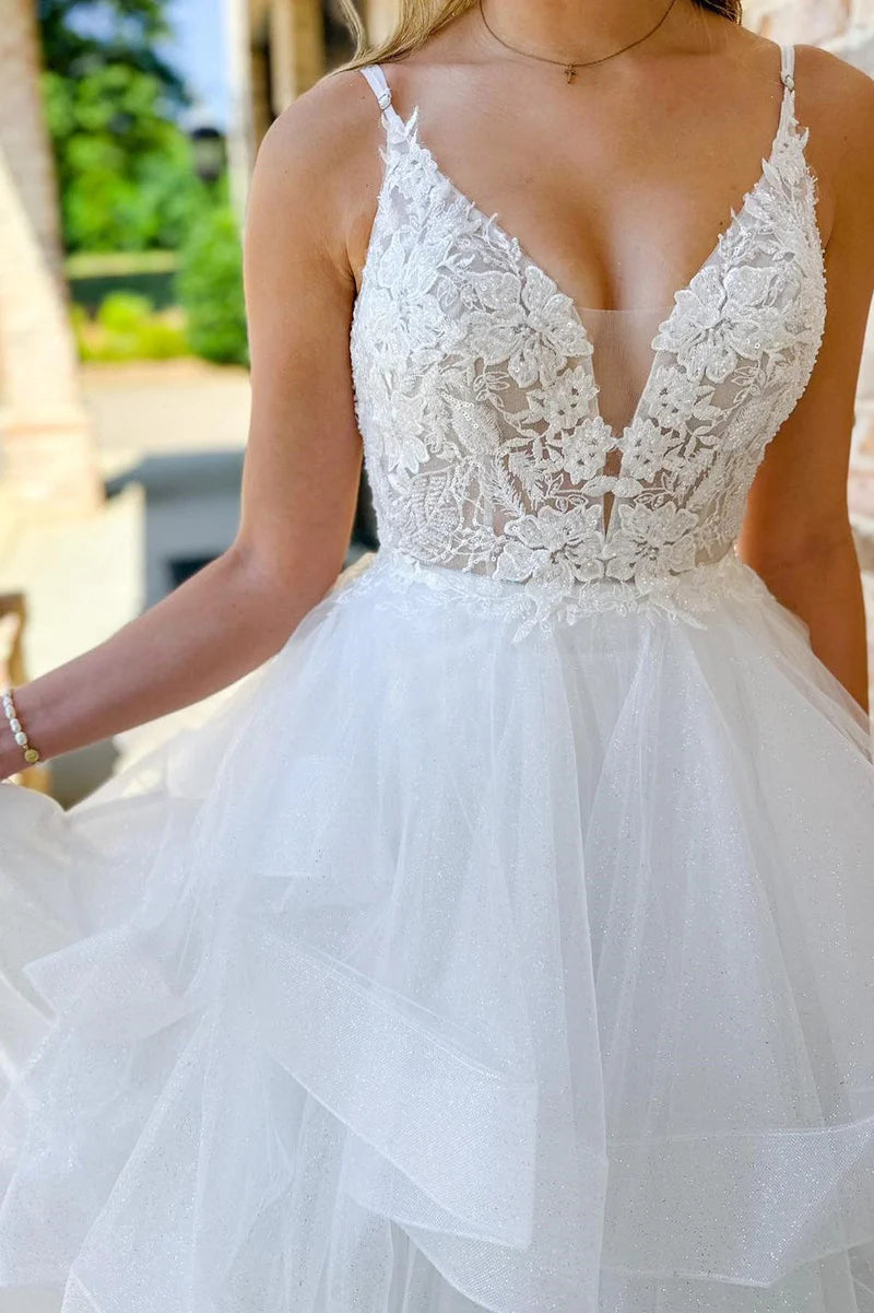 Flowing multi-layer skirt of the long A-line wedding dress.