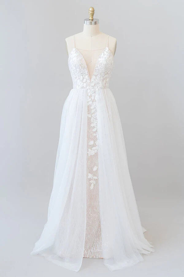 Elegant A-line wedding dress with appliques and chapel train.