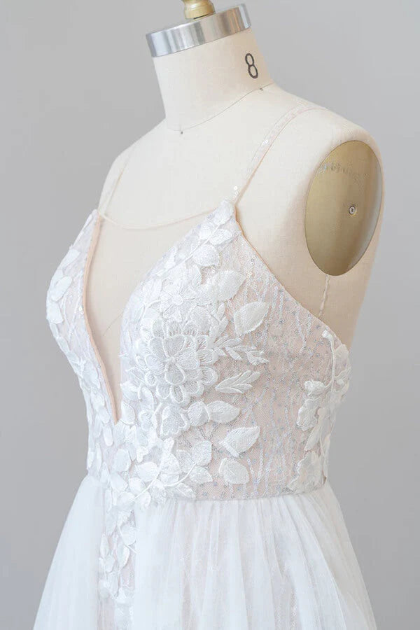 Bride wearing a long A-line V-neck wedding dress.