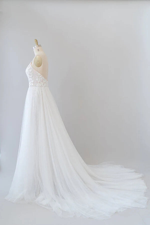 Side view of the A-line wedding dress with flowing chapel train.