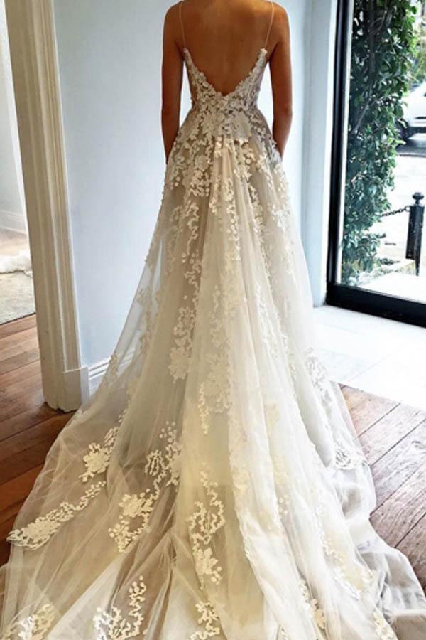 Back view of a tulle wedding dress featuring a court train and V-neck.
