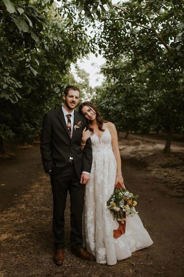 Elegant A-line V-neck wedding dress with delicate appliqued straps.