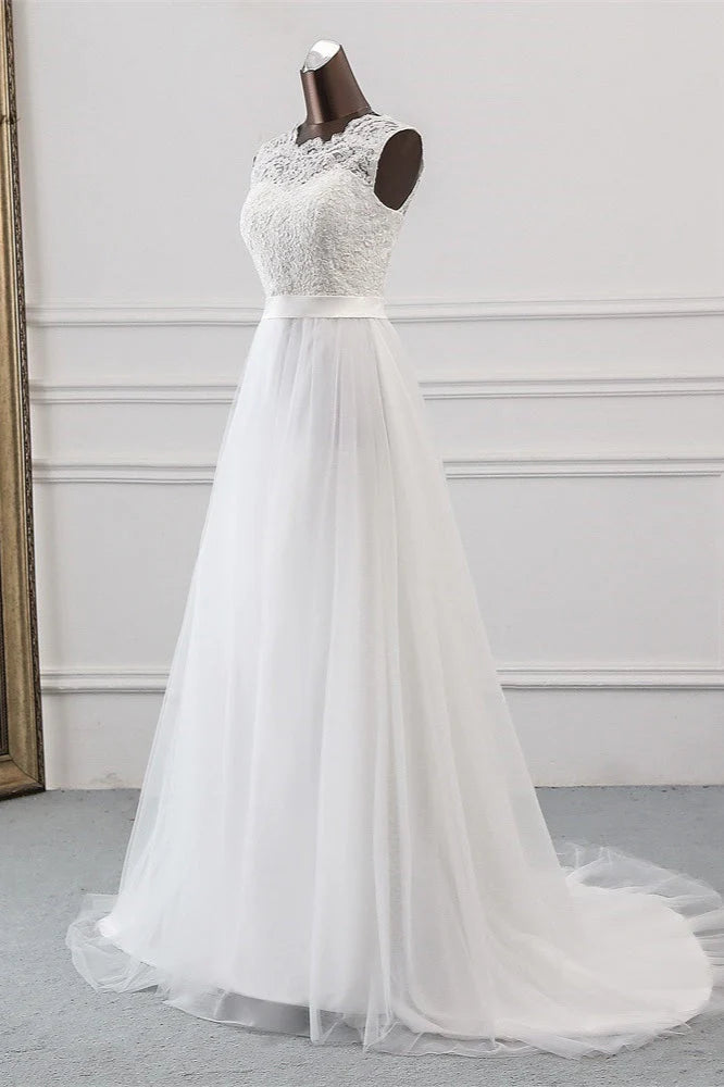 Close-up of the V-neckline and lace appliques on the wedding dress.
