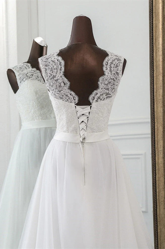 Detailed view of the lace appliques on the tulle wedding gown.