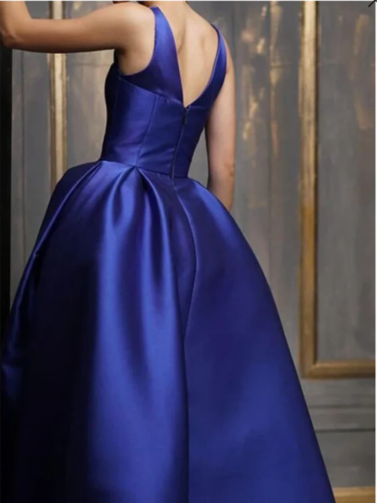 Side view of the flowing A-line satin evening dress, highlighting its asymmetrical design.