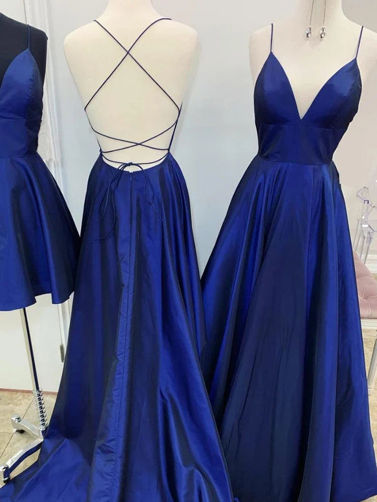 Woman wearing an elegant A-line V-neck backless long dress.