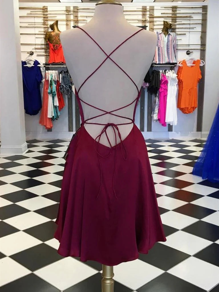 Back view of an A-line short evening dress with backless design.