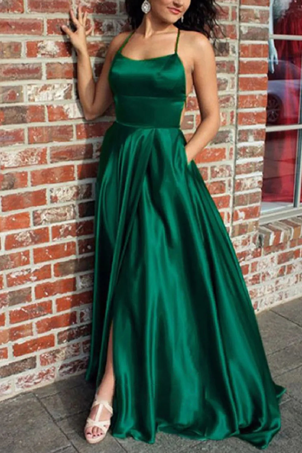 Elegant A-line satin prom dress with V-neck and backless design.