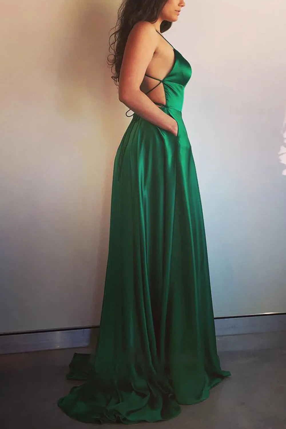 Back view of the elegant backless satin prom dress.