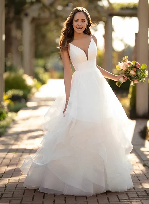 Elegant A-line V-neck wedding dress with cascading tulle ruffles.