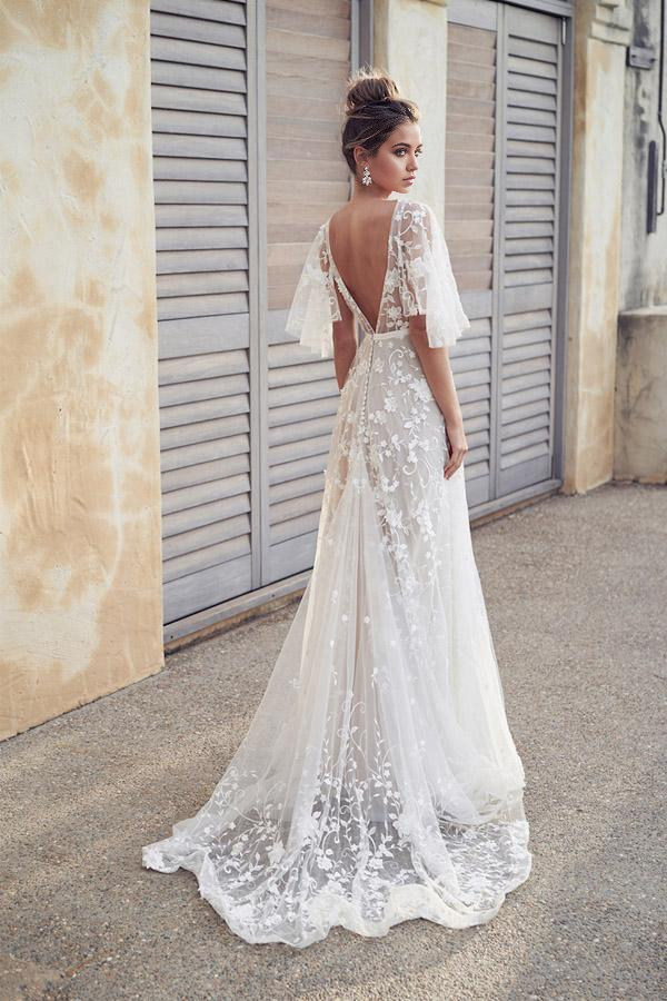 Ivory A-line wedding dress featuring a V-neck and lace appliques.