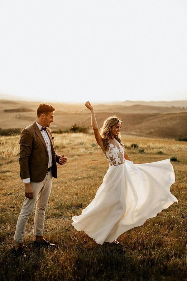 A-line V-neck beach wedding dress with sheer details.