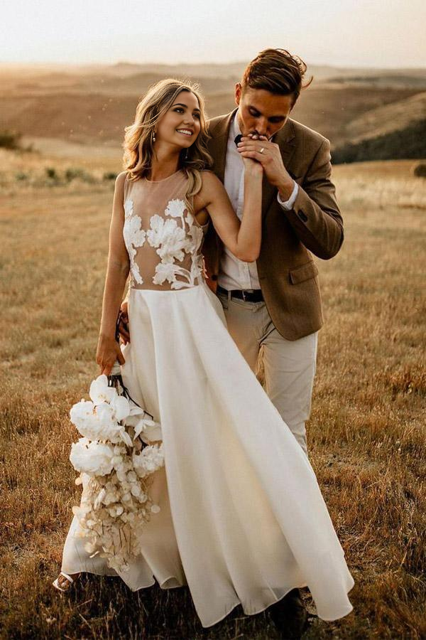 Back view of a flowing A-line bridal gown for rustic weddings.