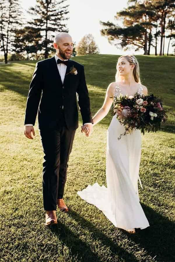 Flowing A-line skirt and delicate illusion train of the wedding dress.