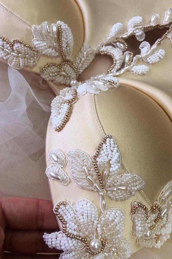 Close-up of intricate beading on the V-neck bodice of the formal dress.