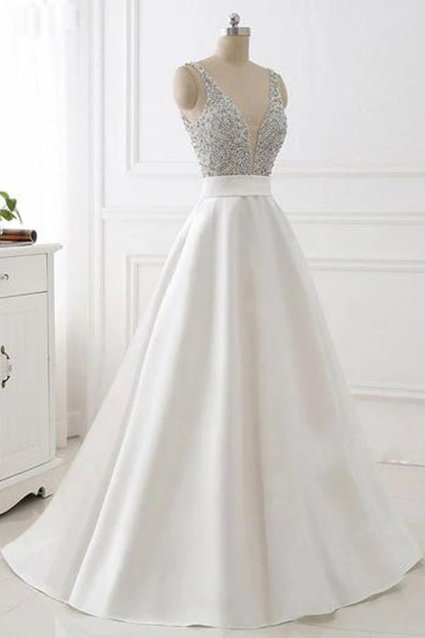 Close-up of the intricate beaded V-neck top on the satin prom dress.