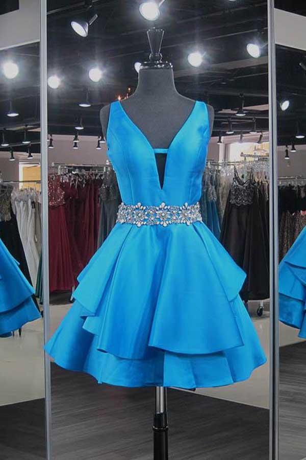 Model wearing a blue A-line V-neck short satin homecoming dress with beadings.