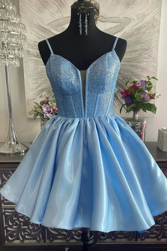 A-line V-neck short homecoming dress with delicate beading and spaghetti straps.
