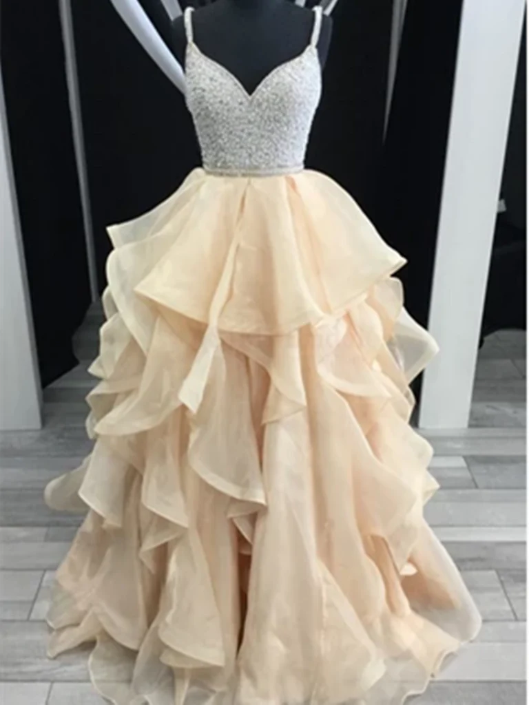 Elegant A-line V-neck beaded tulle long prom dress with flowing layers.