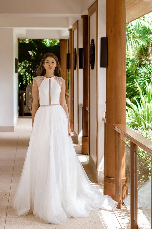 Elegant A-line wedding dress with V-neck and intricate beading.